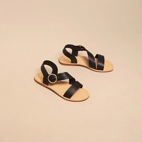 Asymmetrical sandals in black leather